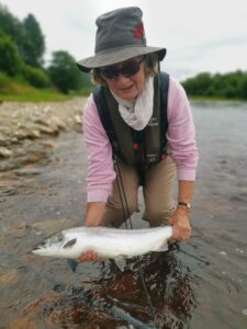 Another happy lady angler with a bar of silver