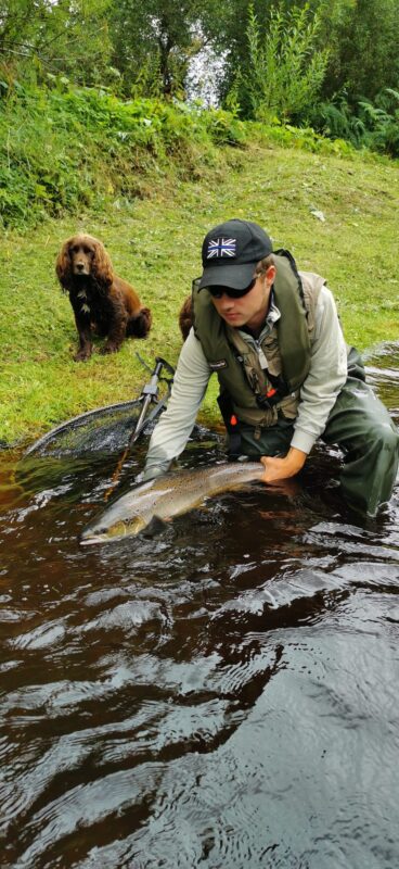 Archie releasing his fish