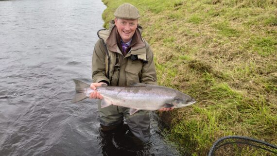 Grant Morrison with Mrs Constantineโs 17lb fish from Beaufort