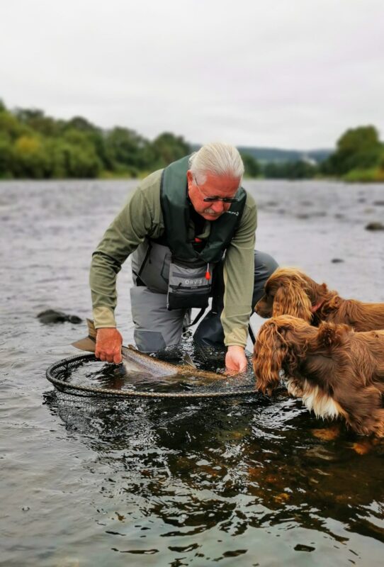 The 2 Ghillies inspecting the fish and ensuring careful handling !!!