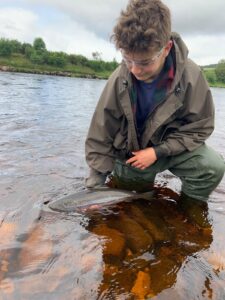 Thomas Robertson releasing another fresh fish