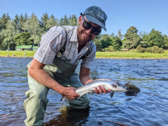 Fox Wincott with his first fish from the left bank of the Back oโ the Bog
